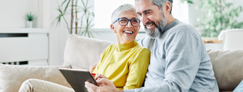 Happy seniors chatting with reverse mortgage advisor